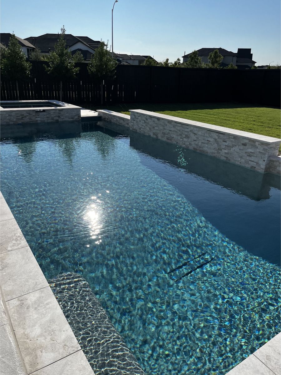 Modern pool and spa combo with balanced, clear water after maintenance